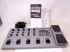 A Korg AX1000g modelling signal processor with lead and instruction book.