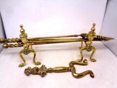A heavy quality brass three piece fire companion set, with pair of stands and fire dog front.
