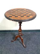 A Victorian mahogany chess board topped pedestal wine table