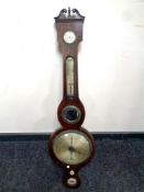 A George III banjo barometer with silvered dial