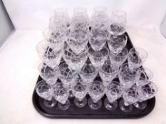 A tray containing assorted lead crystal drinking glasses to include liqueur and brandy
