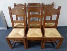 A harlequin set of six farmhouse rush seated chairs