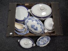 A box containing 19th century blue and white dinner ware, tureens, gravy boat.