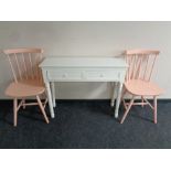 A pair of painted spindle back kitchen chairs together with a contemporary two drawer side table