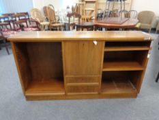 A set of 20th century walnut bookshelves fitted with central door