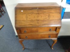 A 20th century walnut Queen Anne style bureau