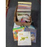 A box containing a quantity of vinyl LPs and 7" singles to include easy listening, classical,