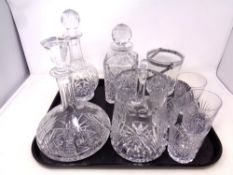 A tray containing a quantity of cut glass, lead crystal to include water jugs with beakers,