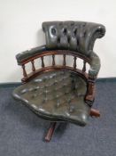 A green buttoned leather Chesterfield captains desk chair