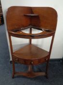 A Georgian mahogany corner wash stand