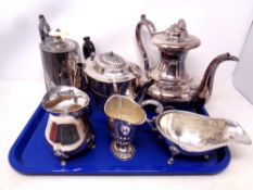 A tray containing four pieces of silver plated tea ware together with a further silver plated jug