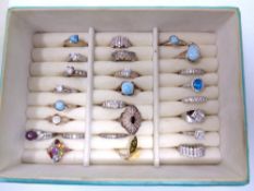 A ring box containing 25 silver rings.