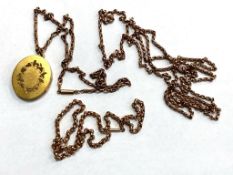 An antique yellow metal muff chain, together with two further chains and a pendant.