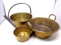 Three pieces of antique brass ware to include cast iron handled jam pan,