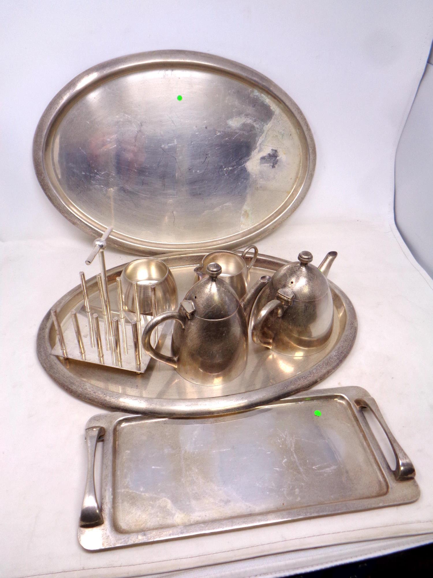 A Likmot Sheffield collection four piece plated tea service together with three trays and further