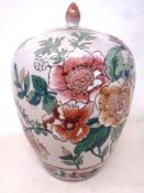 A Chinese lidded bulbous vase decorated with flowers, character marks to base.