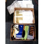 Two boxes containing a quantity of assorted table linen, woolen blankets, clothes brushes,