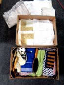 Two boxes containing a quantity of assorted table linen, woolen blankets, clothes brushes,