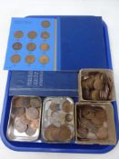 A tray containing two folders of Great British pennies,