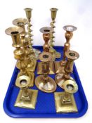 Five pairs of antique and later brass candlesticks