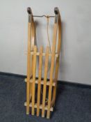 A vintage Gloco wooden sledge