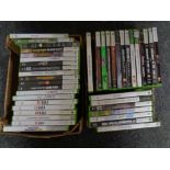 Two boxes containing a quantity of Xbox 360 games to include Grand Theft Auto, WWE, Fifa,