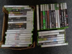 Two boxes containing a quantity of Xbox 360 games to include Grand Theft Auto, WWE, Fifa,