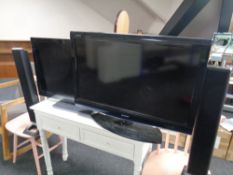 Two LCD TV's by Sharp and Panasonic (continental wiring) together with two floor standing speakers.