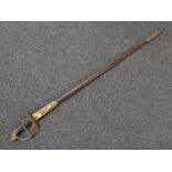 A 19th century brass hilted court sword in leather and brass mounted scabbard