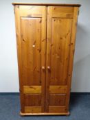 A pine double door wardrobe