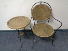 A wrought iron and wicker patio armchair with matching wine table