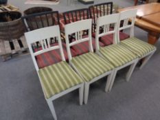 A set of four painted dining chairs (white) together with a further set of three painted rail back