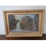 An antiquarian oil on canvas of a waterfall in a gilt composite frame.