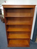 A set of Yew wood open bookshelves