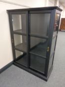 An Ikea double sliding door display cabinet