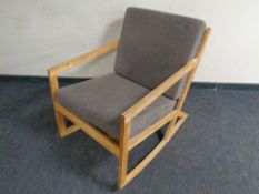 A contemporary oak rocking chair