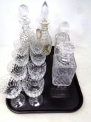 A tray containing a set of eight lead crystal wine glasses together with four further lead crystal