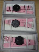 A box containing a quantity of Lyfe wristwatches on fabric straps.