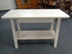 An Ikea two tier side table fitted with drawer