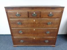 A George III inlaid oak six drawer chest