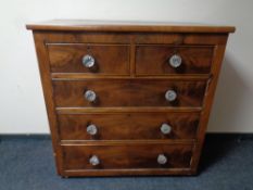 A Victorian mahogany five drawer chest with glass handles
