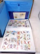 Two albums of 20th century world stamps and commemorative society first day covers of the world