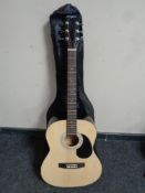 A Martin Smith W-101-N-PK (natural) acoustic guitar in carry bag.