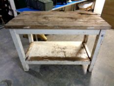 An antique pine plank top two tier butchers block table