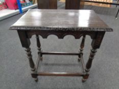 A 19th century oak carved occasional table