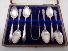 A set of six cased Sheffield silver teaspoons with sugar tongs
