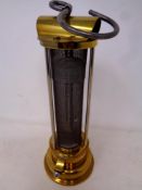 A reproduction E William Thomas brass miners lamp.