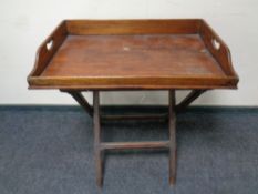 A Victorian mahogany twin handled tray on X frame stand