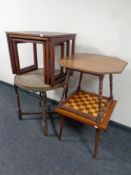 An Edwardian octagonal carved oak occasional table together with a eastern brass topped table on