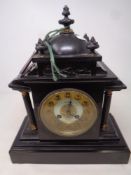 A 19th century black slate mantel clock retailed by G Parkin of Newcastle Upon Tyne